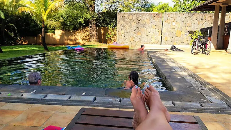 Relaxing by the pool during a house sit in Mauritius